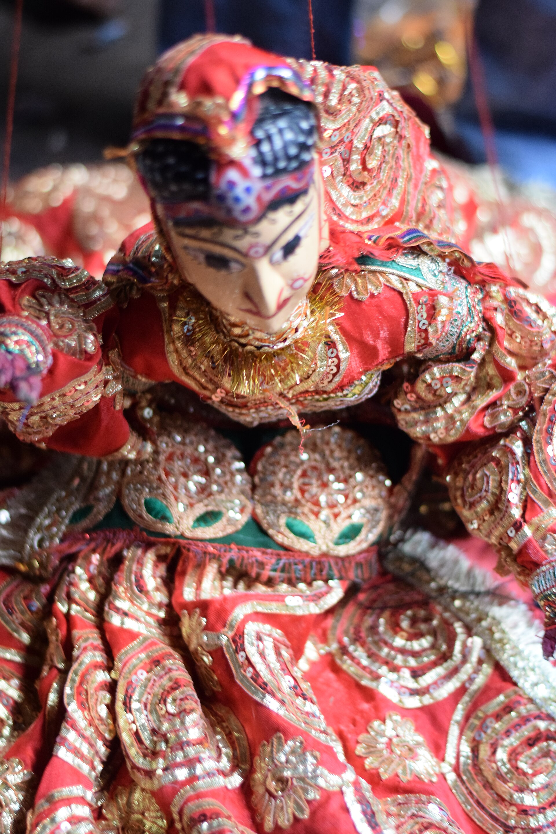 Theyyam ritual performance with towering headdress at a sacred grove